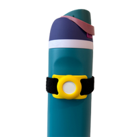 A yellow Bottle Beacon AirTag holder strapped to a teal water bottle